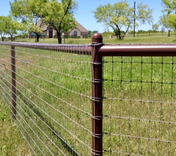 Wire Mesh Fencing Installation with Church Background